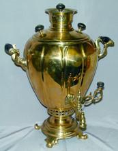 The body of the samovar is in excellent condition with mineral deposit in the interior due to frequent use.