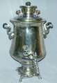 The body of the samovar is in excellent condition with mineral deposit in the interior due to frequent use. No maker's  marks are visible. The height of the samovar is approximately 54cm and the volume is approximately 7 liters.
