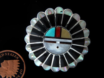 Sun Face pendant / pin in Sterling by Zuni artists Verdelle & Ester Niiha available at Sacred Bear Jewelry.