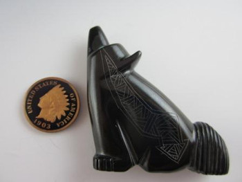 Coyote fetish carved from Black Marble by Zuni carver Daphne Neha available at Sacred Bear Jewelry.