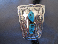 Bolo tie in Sterling bu Navajo artist Mike Thomas available from Sacred Bear Jewelry.