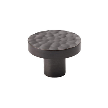 Dark bronze hammered-style cupboard knob with a circular face and thick stem, ideal for kitchen cabinets and furniture.