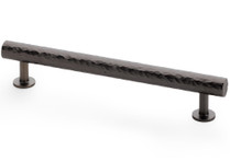 Dark bronze hammered cabinet pull handle with textured brass finish and T-bar design