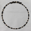 Gold Filled beads and Onyx Beads on a memory wire choker. 