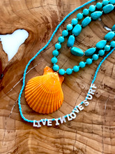 Large shell with turquoise blue stones 
