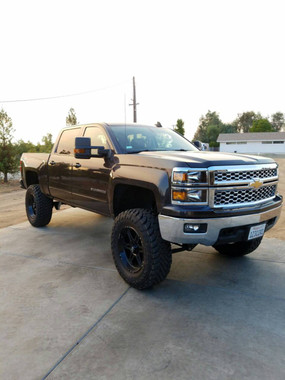 James' super clean 2015 Chevy Silverado 1500 Running a McGaughy's Suspension 7-9" Black SS Lif Kit From Mcgaughy's Store set at 9" with rear add a leaf. Sitting on 37x12.50 toyos on 20" Hostile Havocs!  Front View