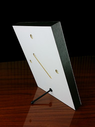 The back of the 8x10 panel showing the included stand and pre-drilled mounting holes.