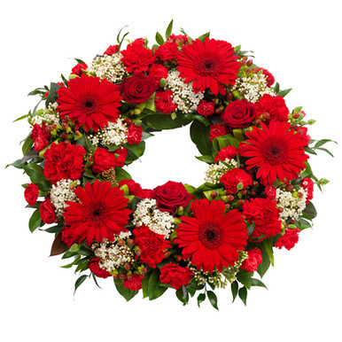 Red flowers sympathy wreath for sweden delivery, it includes red gerberas.