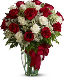 Red and white roses arranged with greenery and red ribbon sweden flower local delivery.