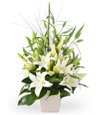 Premium flower arrangement of white oriental lilies for sweden delivery.