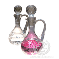 This pair of glass cruets comes with a sandblast design. The water and wine cruet capacity is 11.6 OZ and come with glass stoppers to help keep the contents sealed. 

Cruet Details:

Glass
Sandblast Design
Stopper Top
Cruets:
11.60 OZ Capacity
7.5" Height (w/stopper)
Sold as a pair
From Poland