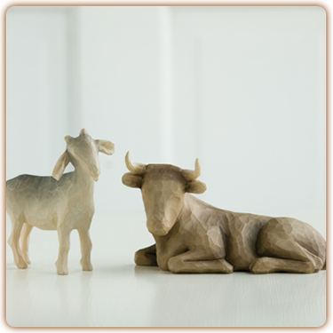 Offering Warmth and Protection ~ the Goat and the Ox.  Their calm demeanor expresses warm attentiveness for the christ child. The tallest figure stands 3.5 inches tall.