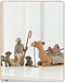 Surrounding New Life with Love and Warmth. This carved four-piece animal set of shepherd, camel, two sheep, and goat, complements the scale of the classic six-piece Nativity. The tallest figure stands 7.5 inches tall.