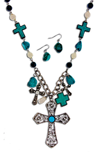 A very pretty set is this necklace and earrings with variety of crosses in Turquoise/silverplate. Length approx 18", Big cross 2.3" x 3", Lobster claw clasp with 3" extender, Lead and nickel compliant.