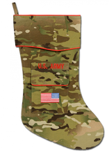 The Army MultiCam Christmas stocking is the newest addition to the collection. MultiCam is the fabric used by the Army for uniforms warn by Soldiers deployed in Afghanistan. It is not widely recognized stateside by the general public. The stocking is trimmed in scarlet piping with the "reverse American flag" embroidered on the stocking pocket. Above the pocket is the embroidered "U.S. ARMY" service tape. The price of this stocking is higher due to the higher cost per yard of this fabric.