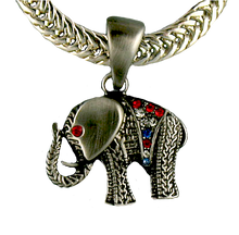 This Elephant neckslide is pewter toned and the jeweled blanket is adorned with red, white and blue crystals.  The eye is a red crystal.