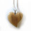 Small pale horse hoof heart necklace. Measures 3cm across,